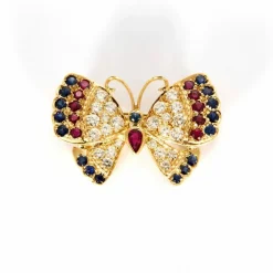 Broche Papillon or jaune, saphirs, rubis