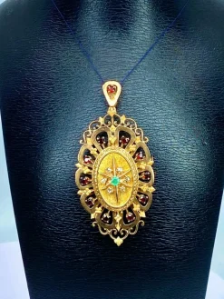 Broche pendentif or, grenats, émeraude, diamants