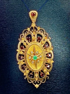 Broche pendentif or, grenats, émeraude, diamants