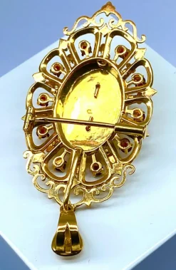 Broche pendentif or, grenats, émeraude, diamants