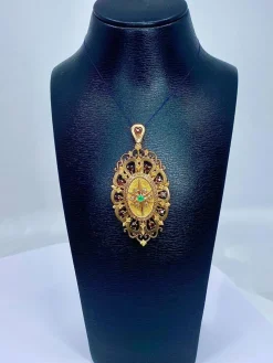 Broche pendentif or, grenats, émeraude, diamants