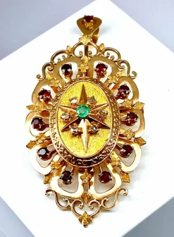 Broche pendentif or, grenats, émeraude, diamants