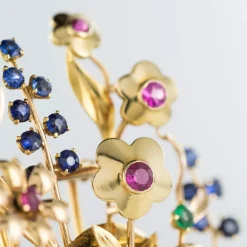 Broche rétro bouquet or et pierres précieuses