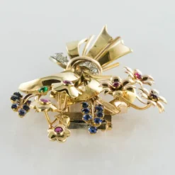 Broche rétro bouquet or et pierres précieuses