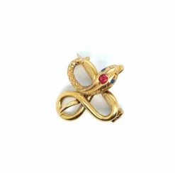 Broche Serpent or jaune, rubis, topaze
