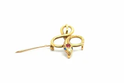 Broche Serpent or jaune, rubis, topaze