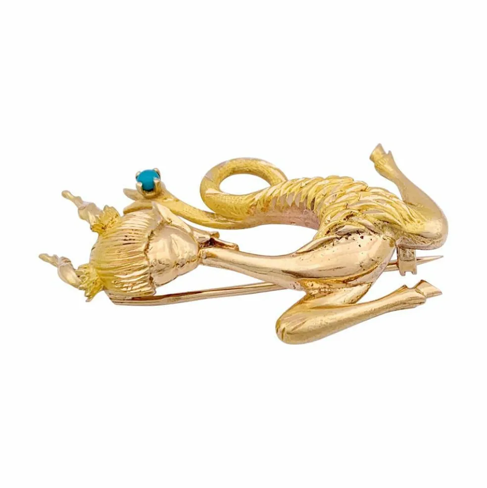 Broche vintage "Capricorne", or jaune, turquoise.