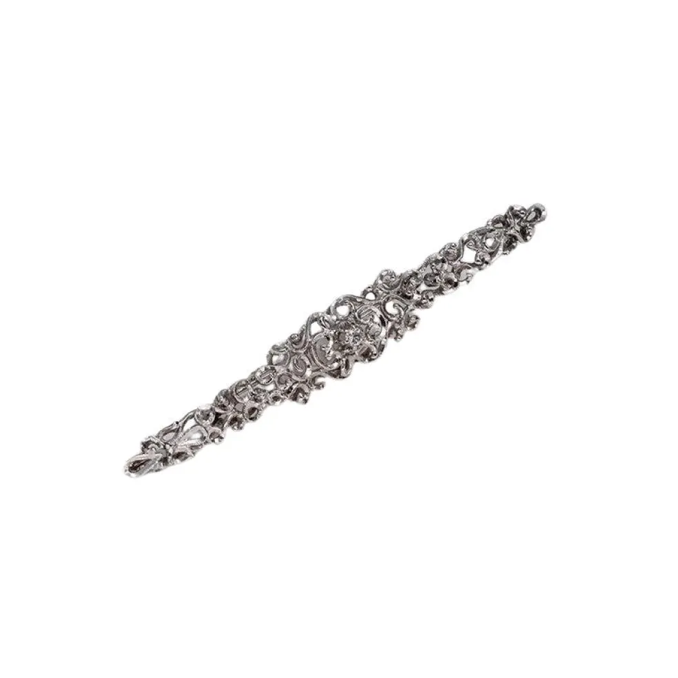 Broche vintage en or blanc