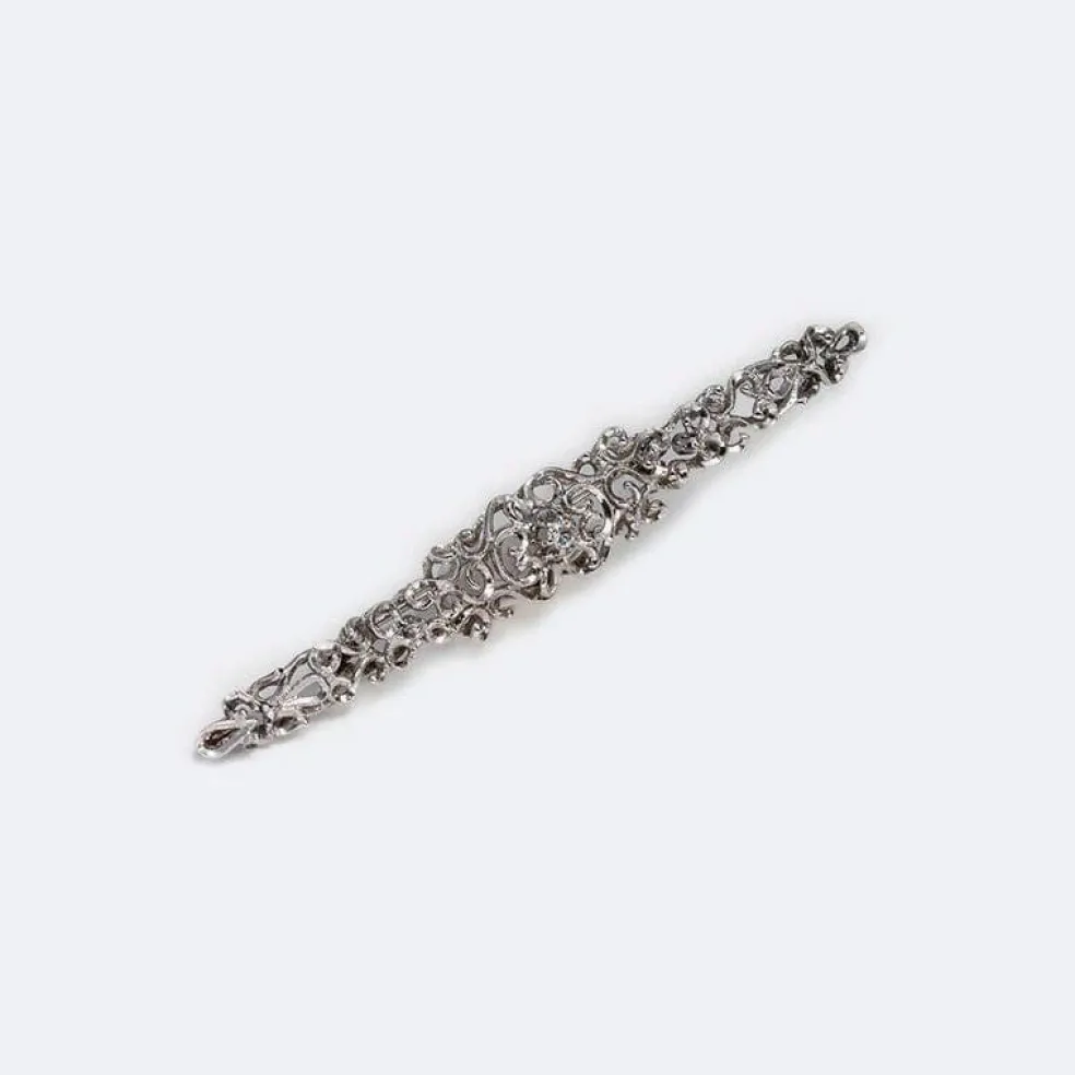 Broche vintage en or blanc