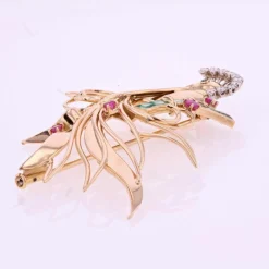 Broche vintage oiseau de paradis diamants émeraudes rubis