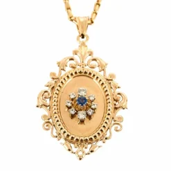 Chaîne en or jaune et pendentif porte souvenir ouvrant or , diamants et saphir