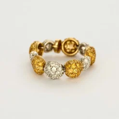 CHANTECLER - Bagues souples en or jaune et or gris, diamants et saphirs jaune