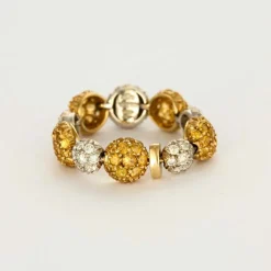 CHANTECLER - Bagues souples en or jaune et or gris, diamants et saphirs jaune