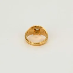 Chevalière or jaune et gris centré d'un diamant