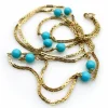 Collier 36 stations en perles turquoise dorées