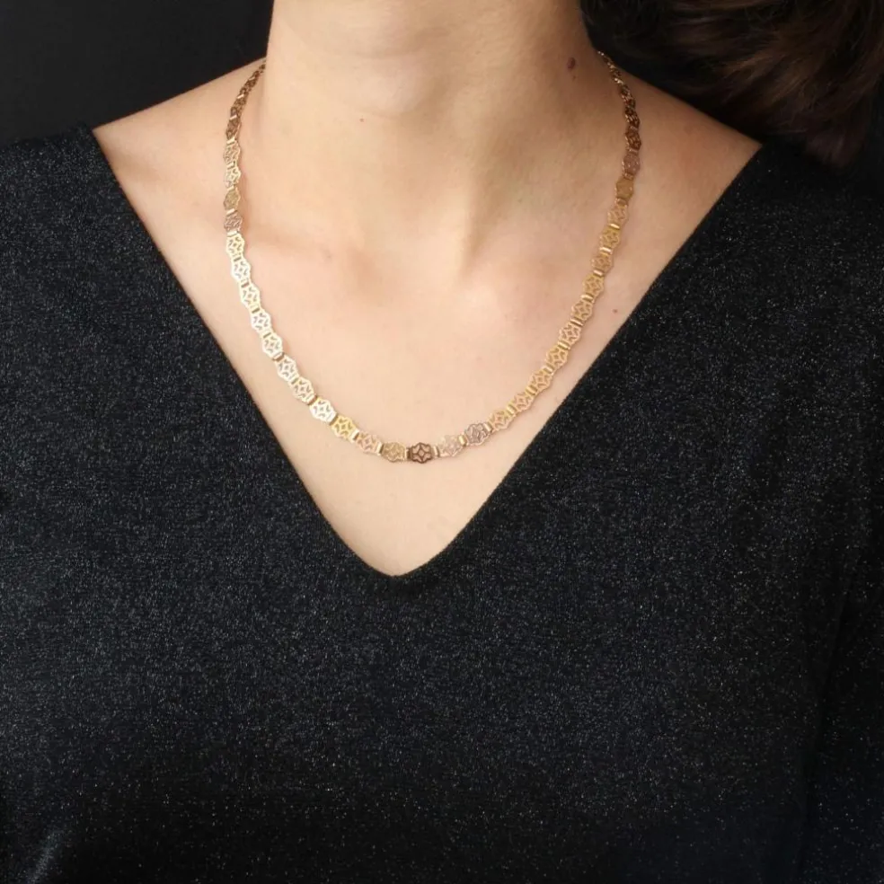 Collier ancien en or rose à motifs ajourés et articulés