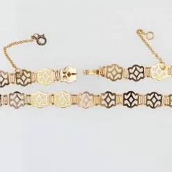 Collier ancien en or rose à motifs ajourés et articulés