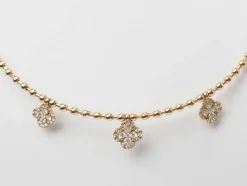 Collier boules rigide et trèfles en or rose et diamants