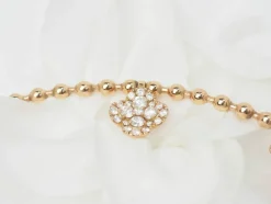 Collier boules rigide et trèfles en or rose et diamants