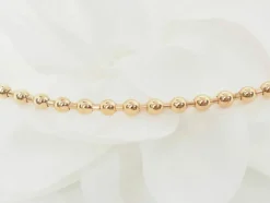 Collier boules rigide et trèfles en or rose et diamants