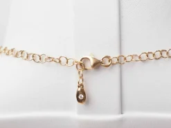 Collier boules rigide et trèfles en or rose et diamants
