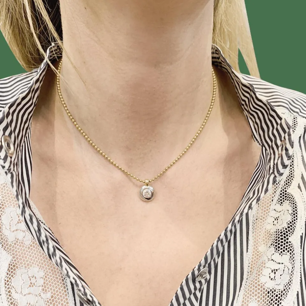 Collier deux ors, diamant.