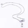Collier en or blanc, opale, diamants et émeraude