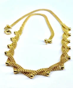 Collier en or jaune 18 carats à décor de petites boules