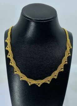 Collier en or jaune 18 carats à décor de petites boules