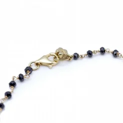 Collier en or jaune et spinelle motif floral