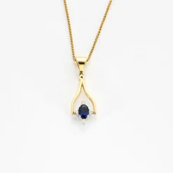 Collier en or jaune mobile avec saphirs et diamants