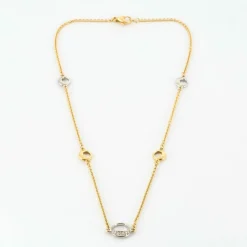 Collier en or jaune, or blanc et diamants