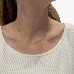 Collier gouttière en deux tons d'or serti de diamants.