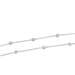 Collier gouttière en or blanc, diamants.