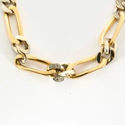 Collier maille figaro en or jaune et gris, et diamants