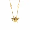 Collier or jaune à motif d'abeille, diamants et rubis