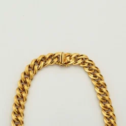 Collier or jaune diamants centré d'une pièce de bronze