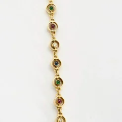 Collier or jaune, saphir, émeraudes et rubis