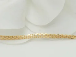 Collier pendentif croix en or jaune et grenats