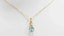 Collier solitaire or jaune topaze bleue
