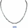 Collier tennis en or blanc serti clos et diamants mixtes