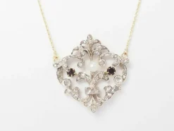 Collier volutes en or jaune et argent, grenat diamants et perle