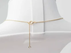 Collier volutes en or jaune et argent, grenat diamants et perle