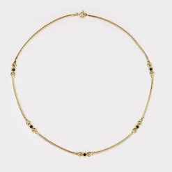 Fin collier or maille gourmette plat et ses motifs avec saphirs