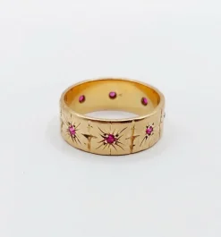 Large bague jonc Art Déco or rose, rubis sertis étoilés (circa 1950)