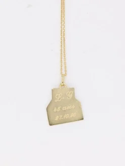 Médaille Augis lettre d’amour or et rubis, Plus qu’hier moins que demain