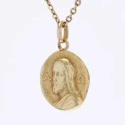 Médaille de baptême or jaune Christ Catacombes signée Becker