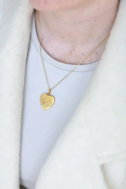 Médaillon cœur ouvrant en or, diamants, et perles