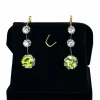 Paire de boucles d’oreilles en or jaune 18 carats et platine, diamants et peridots