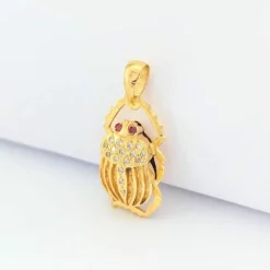 Pendentif animalier en or jaune diamants et rubis